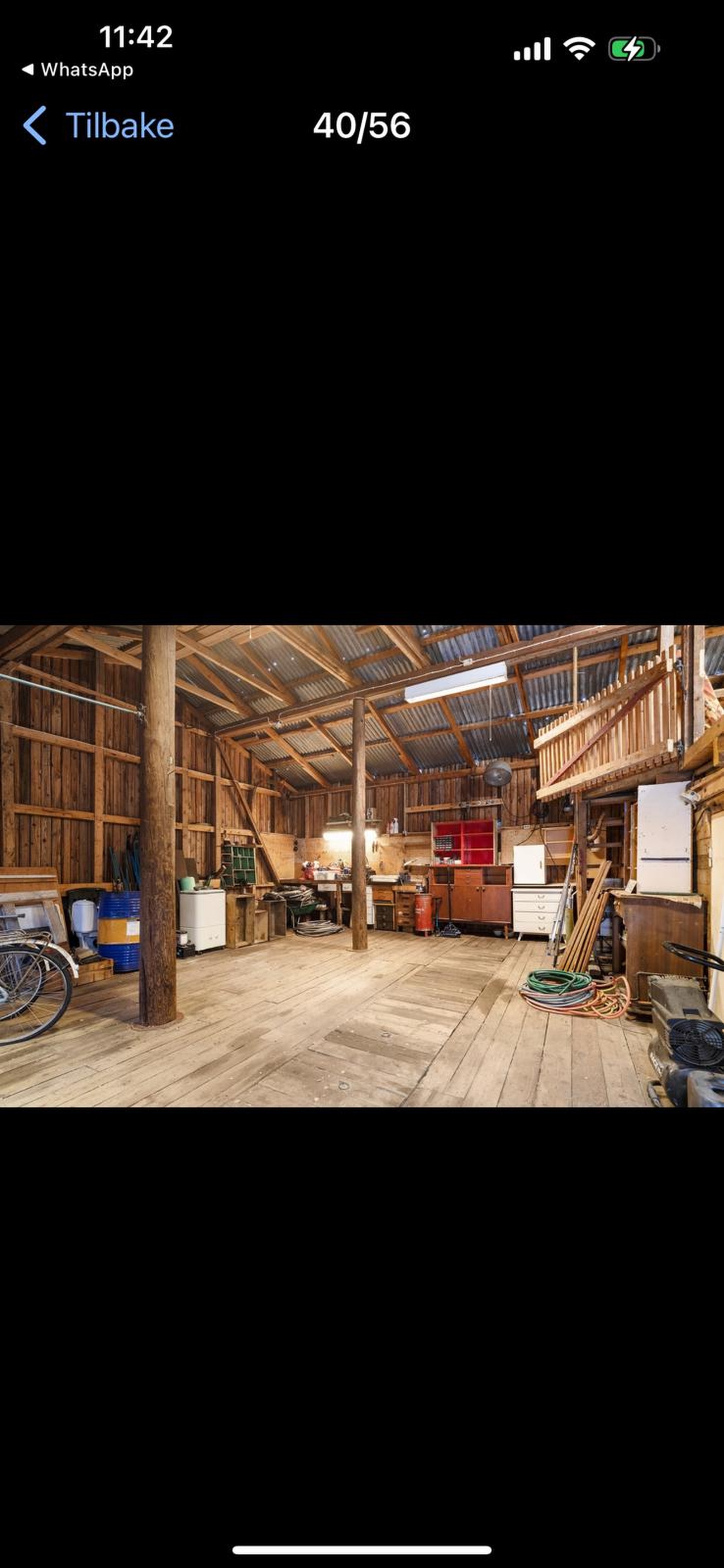 Traditional Norwegian red boathouse at Lake Totak, Sandland location